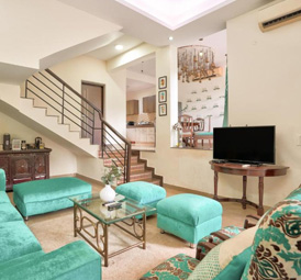 Spacious luxury villa hall with sofa and TV