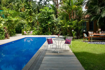 Swimming pool, garden, and chair
