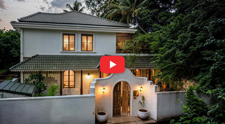 Luxury villa in Goa with elegant architecture surrounded by greenery.