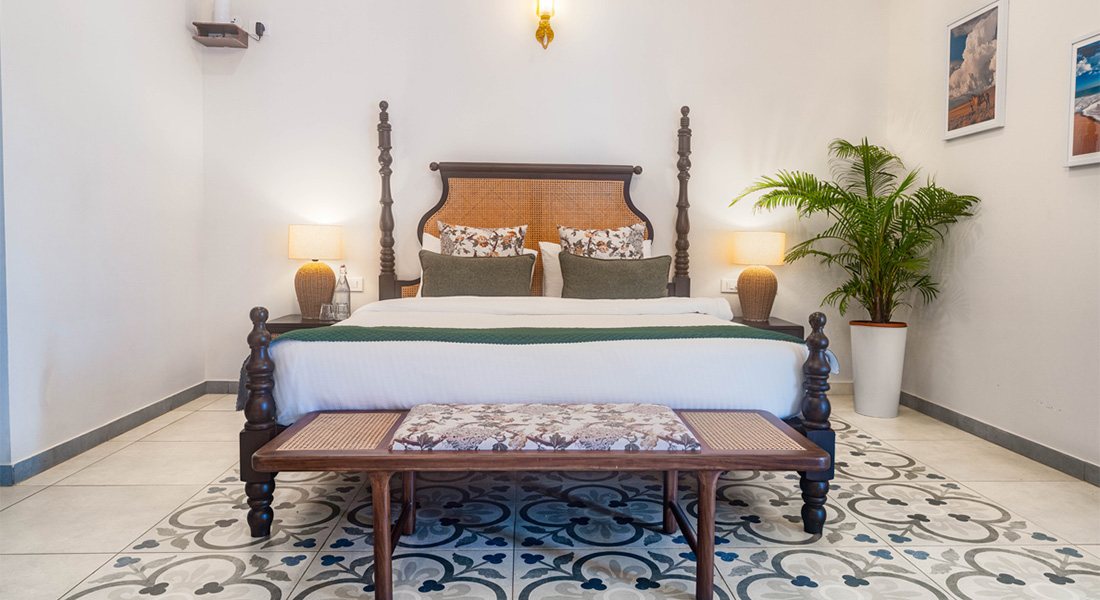 Luxury villa bedroom with king bed and bedside lamps