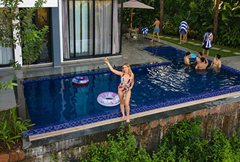 Guests enjoying a private villa pool