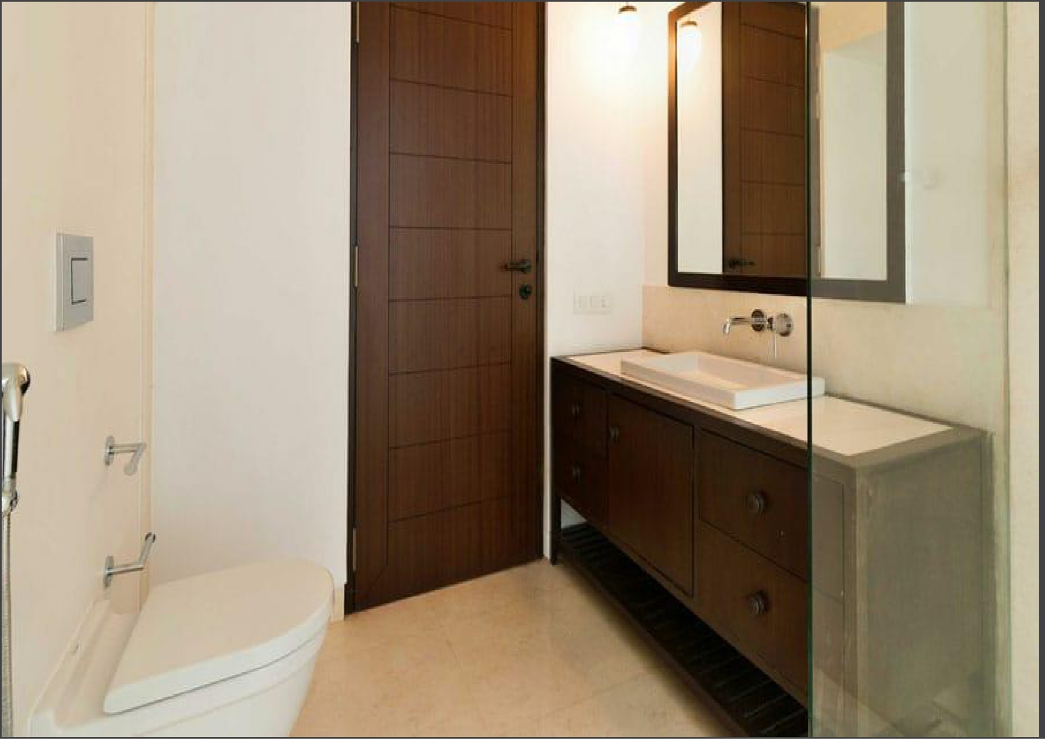 Minimalist bathroom with sleek vanity and wall-mounted toilet