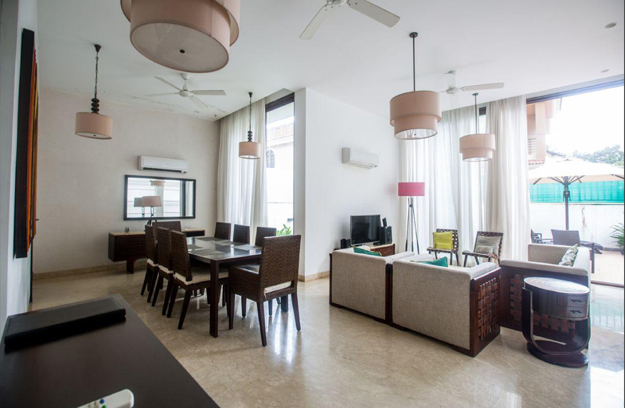 Open-plan living and dining area with bright interiors and stylish furniture