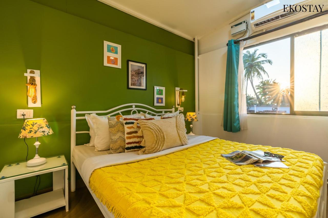 Cozy villa bedroom with queen bed and window view