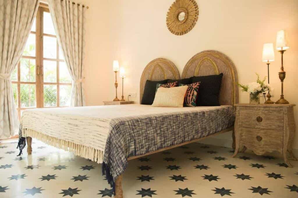Elegant villa bedroom with large bed and window