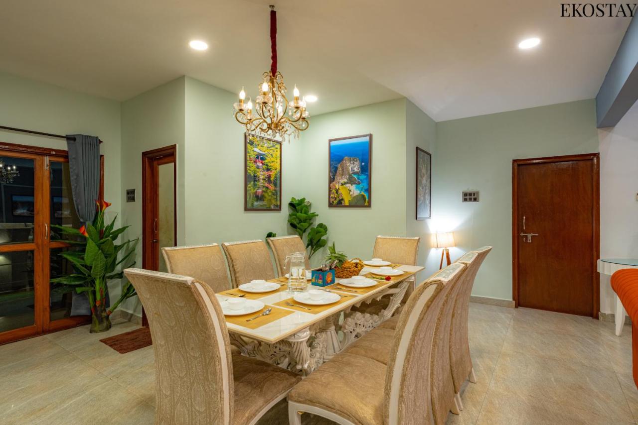 Elegant villa dining room with chandelier and dining table