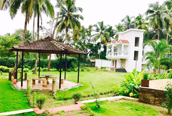 Angle's Villas exterior with palm trees