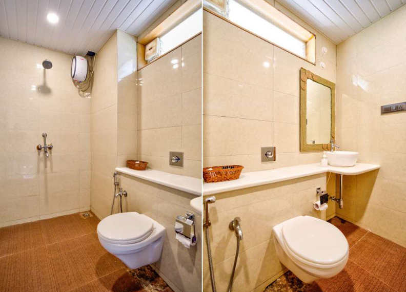 Clean modern villa bathroom with shower, toilet and wash basin