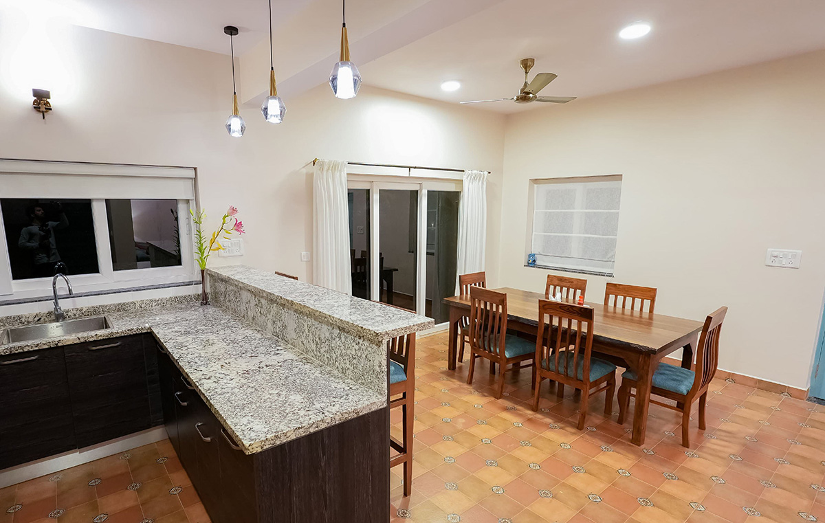Kitchen with granite counter and dining table setup