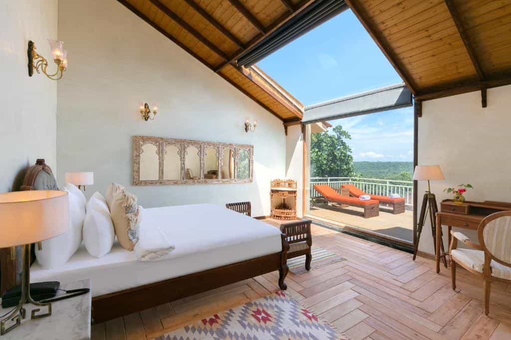 Villa bedroom with private terrace and outdoor loungers