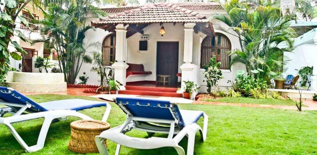 Pet-friendly holiday villa in Goa featuring a lush garden and comfortable outdoor seating