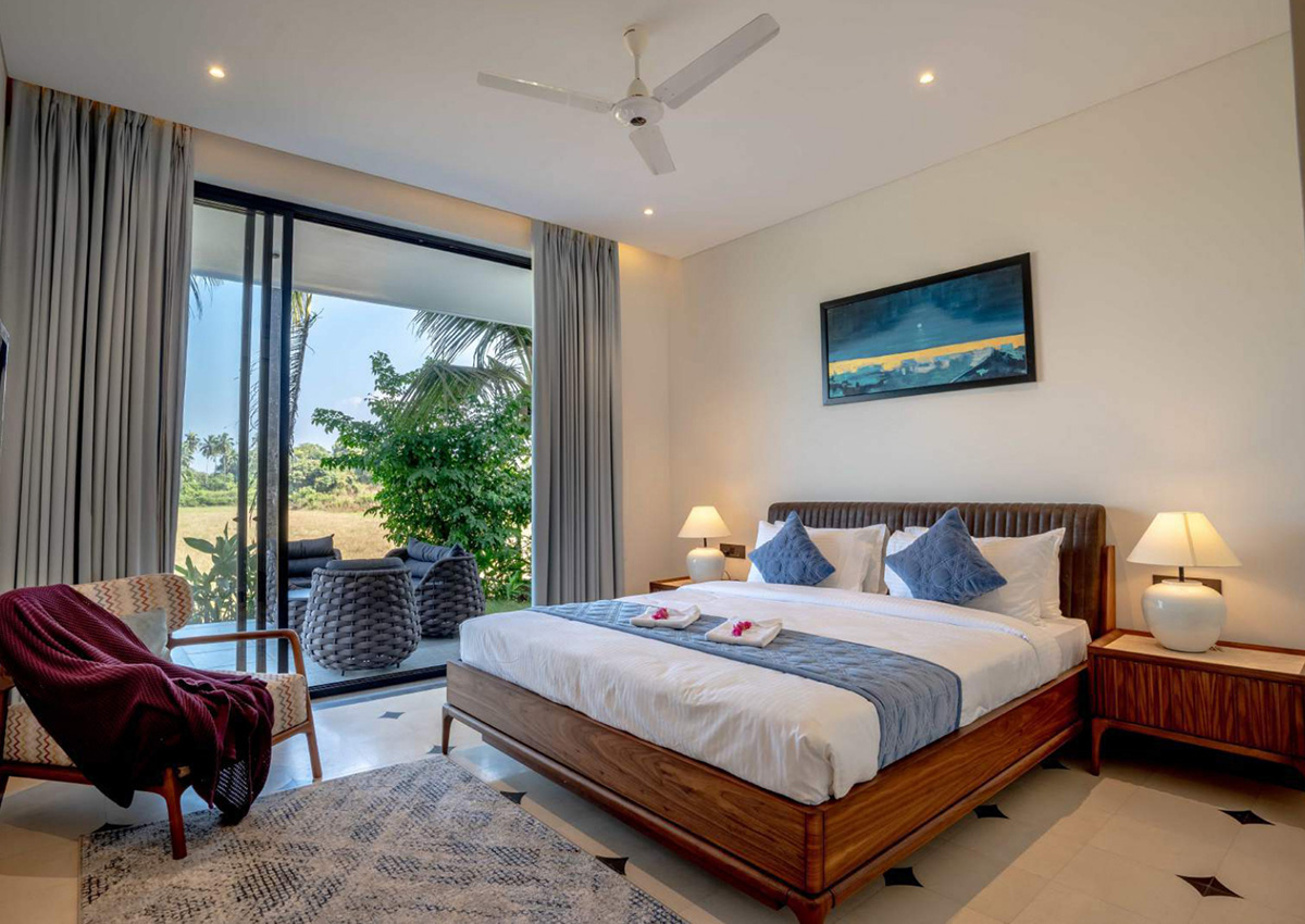 Cozy bedroom with terrace access and outdoor seating area