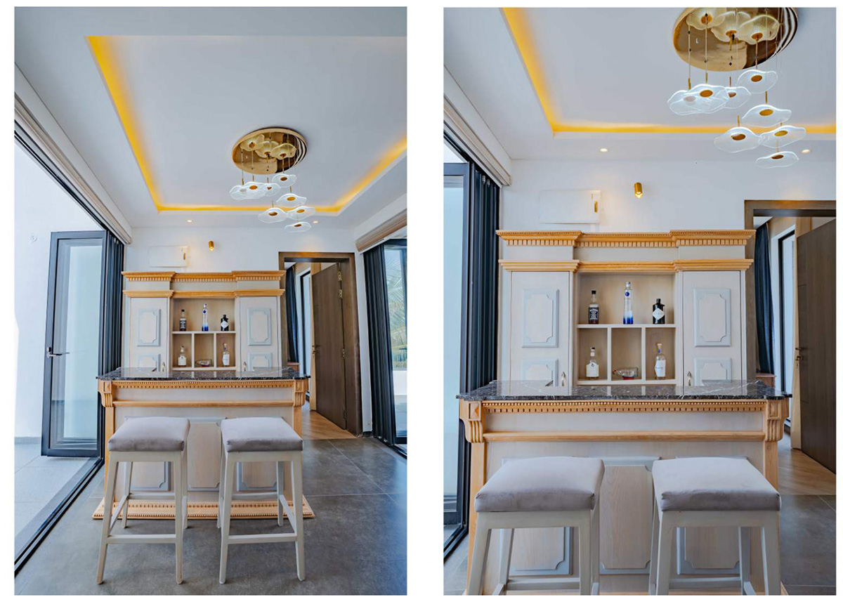 Wide-angle view of indoor bar area with elegant cabinetry and seating